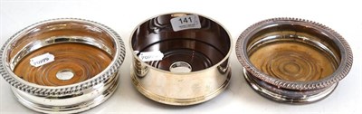 Lot 141 - Modern silver wine coaster and two further plated examples (3)