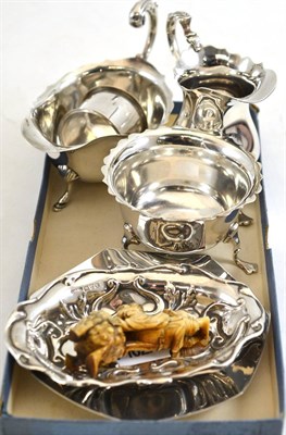 Lot 168 - A collection of small silver including a cream jug, sauce boat, circa 1900 ivory carving, etc