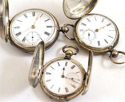 Lot 169 - Two silver full hunter pocket watches and an unusual plated pocket watch with a shutter opening...