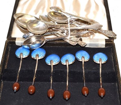 Lot 174 - Set of six enamelled silver bean end coffee spoons in a case and two sets of six coffee spoons with