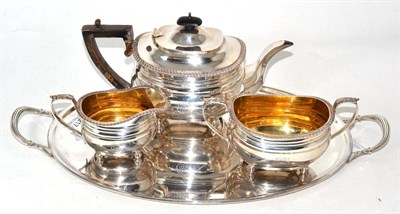 Lot 217 - Three piece silver tea set and a plated tray