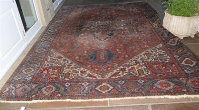 Lot 789 - Heriz Carpet Iranian Azerbaijan, circa 1910 The madder field of angular plants around an ivory...