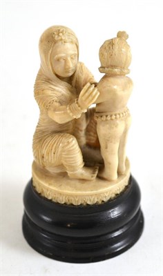 Lot 242 - Indian carved ivory group on wood stand, circa 1900