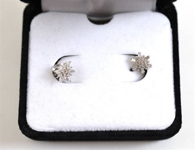 Lot 257 - A pair of diamond cluster earrings with screw post fittings and card of authenticity