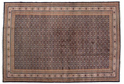 Lot 793 - Modern Indian Carpet The deep indigo field with an allover Herati design enclosed by ivory...