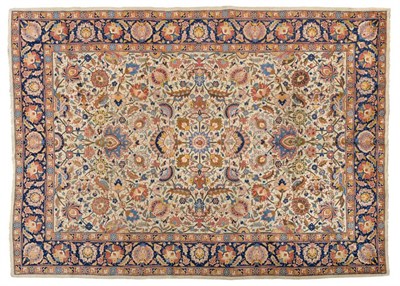 Lot 799 - Tabriz Carpet Iranian Azerbaijan, circa 1950 The ivory field of vines and palmettes enclosed by...