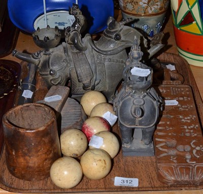 Lot 312 - Indian carved wood mould, two printing blocks, bronze mask door handle, two pottery elephant ewers