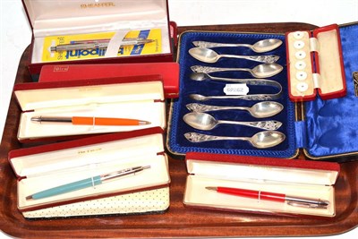 Lot 316 - A set of six silver teaspoons and tongs with pierced finials and a collection of assorted pens, etc