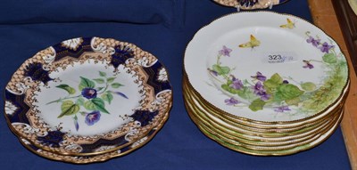 Lot 323 - Three 19th century dessert plates with pierced and gilt borders, each painted with a botanical...