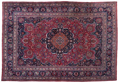 Lot 804 - Doruksh Carpet East Iran, circa 1910 The raspberry field of large palmettes and vines around an...