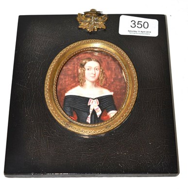 Lot 350 - British School (mid 19th century), A head and shoulders portrait of a lady wearing her hair in...