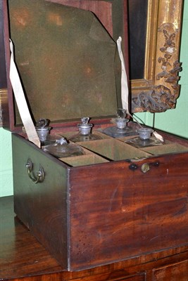 Lot 371 - Georgian mahogany bottle case with five glass bottles