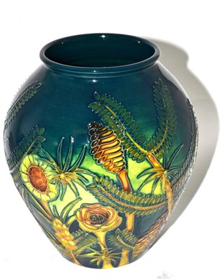 Lot 373 - A modern Moorcroft Amazon Twilight Pattern 4/8 Vase, designed by Nicola Slaney, on a dark green...