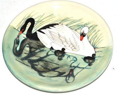 Lot 388 - A William John Moorcroft Swan pattern plate, designed by Sally Tuffin, impressed factory marks...