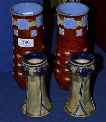 Lot 396 - A pair of Royal Doulton Lambeth stoneware vases, by Bessie Newbery, decorated with stylised ivy...