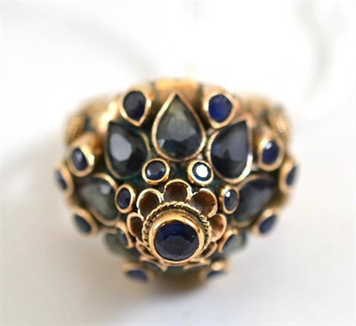 Lot 422 - A sapphire cluster ring, stamped ";14K"