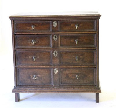 Lot 818 - An Early 18th Century Joined Oak Chest of Drawers, with four graduated two-as-one drawers, the...