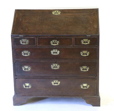 Lot 819 - A George II Oak Bureau, 2nd quarter 18th century, the fall enclosing six pigeon holes and six...