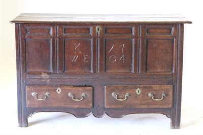 Lot 827 - An 18th Century Joined Oak Chest, carved with initials KWE and dated 1704, the hinged lid above...