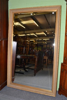 Lot 532 - A large gilt framed mirror with bevelled plate