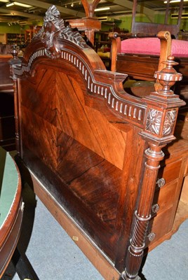 Lot 542 - A Victorian carved and figured walnut double bed frame