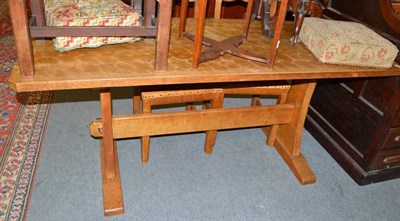 Lot 547 - A Kingpost woodwork oak refectory table, on two shaped supports joined by a stretcher, with...