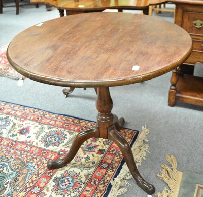 Lot 565 - Georgian oak birdcage tripod table