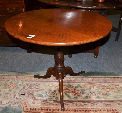 Lot 567 - 18th century oak tripod table