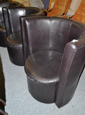 Lot 580 - A set of four simulated leather tub chairs