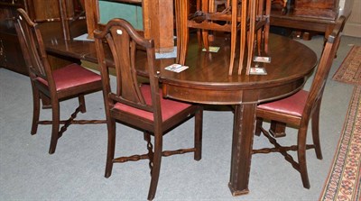 Lot 614 - Dining room suite comprising rosewood table (with extra leaves), chairs and sideboard