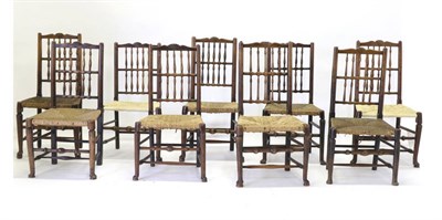 Lot 842 - A Harlequin Set of Eight Ash and Rush-Seated Spindle-Back Chairs, Cheshire region, early 19th...