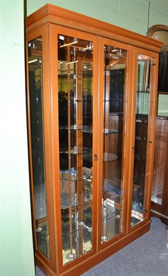 Lot 634 - A Quinn Furniture display cabinet with up-lighters, down-lighters and a central revolving...