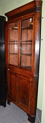 Lot 635 - An oak floor standing corner cupboard