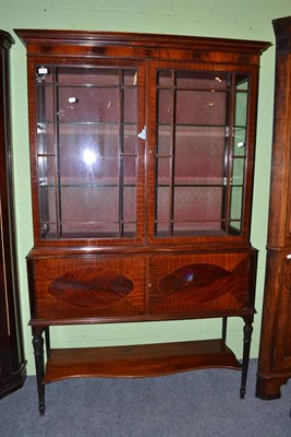 Lot 636 - An Edwardian mahogany display cabinet on a cupboard base