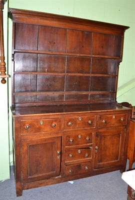 Lot 640 - An 18th century oak dresser and rack