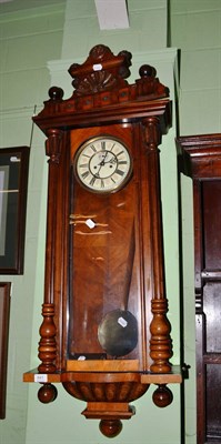 Lot 641 - A walnut Vienna style wall clock striking a single gong