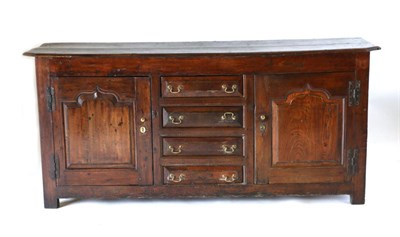 Lot 843 - A George III Oak Enclosed Dresser Base, 3rd quarter 18th century, the rectangular top with...