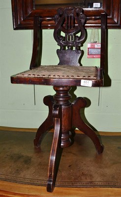 Lot 651 - A stained beech piano stool