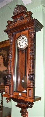 Lot 653 - A Vienna type striking wall clock, with pendulum and two weights