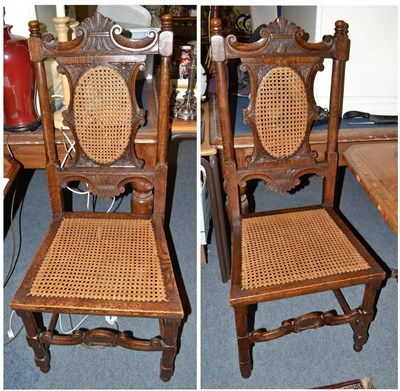 Lot 661 - Two oak cane seated side chairs