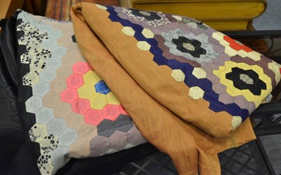 Lot 696 - Circa 1930s patchwork bed cover on a black satin ground, a similar single bed cover, a Turkey...