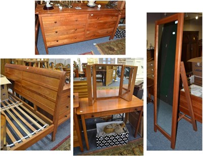 Lot 705 - Reproduction cherry wood bedroom suite comprising super king size bed, six drawer straight...