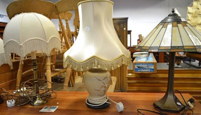 Lot 708 - A Tiffany style lamp and two others