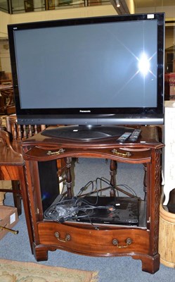 Lot 714 - A Panasonic TH-42PX70BA flat screen TV and a TV cabinet