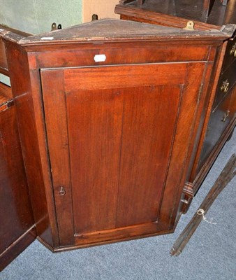 Lot 771 - An easy chair with scalloped back and an oak corner cupboard