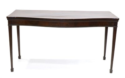 Lot 862 - A George III Mahogany Serpentine Shape Serving Table, late 18th century, with a fluted border above