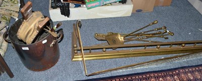 Lot 823 - Two brass fire curbs, five brass fire implements, a pair of bellows, poker and a twin handled...