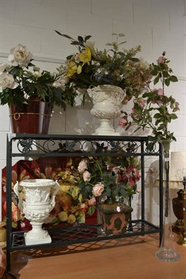 Lot 850 - Two Casa Pupo white pottery urns with silk flowers, two pots of flowers, tall glass vase of...