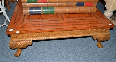 Lot 859 - A reproduction coffee table with simulated leather top