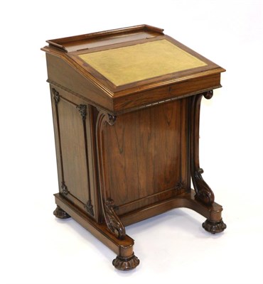 Lot 874 - A William IV Rosewood Davenport, 2nd quarter 19th century, with a three-quarter gallery and leather